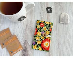 Colorful tea bag wallet with bright yellow and orange aster flowers on the fabric, it has a wooden button and elastic closure.