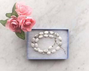 Shades of gray and white beaded magnesite necklace with silver clasp