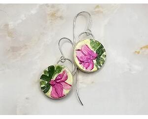Round clay earrings with hand painted pink flowers and green leaves, large silver jump rings embedded and handcrafted silver earring wires. 