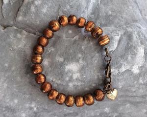 Rustic amber glass beaded bracelet with vintage brass heart charm