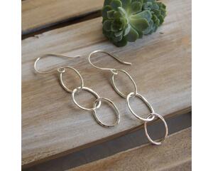 Fine silver triple hoop hammered finish dangle earrings with a sterling silver ear wire.