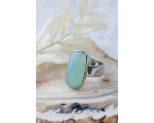 Sterling silver ring band featuring a oblong sea green/blue Chalcedony stone in a sterling silver bezel.