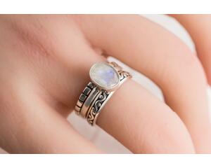 Sterling silver ring with oval faceted moonstone set in a bezel setting with two separate complimentary silver patterned ring band to stack.