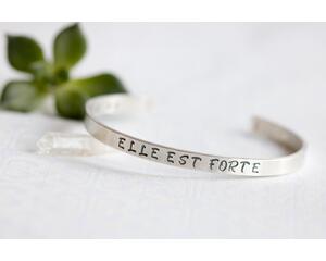 Sterling silver cuff bracelet stamped with Elle Est Forte.