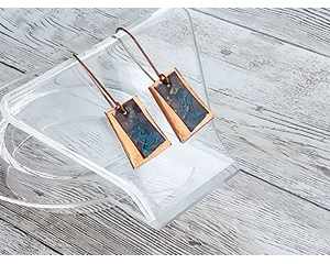 Trapezoid shaped copper earrings. First layer bare textured copper, second layer copper with a blue patina. Handcrafted copper earring wires
