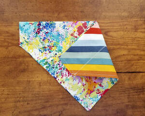 Over the collar reversible dog bandana paint splashes on one side stripes on the other