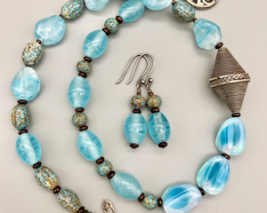 Necklace set | Bali silver focal, cool blue vintage glass beads and faux-turquoise, artisan sterling silver clasp