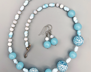 Necklace set | Mid-century "snow-sprinkled" Cherry Brand rounds, pale blue opaline rounds, twisted ovals