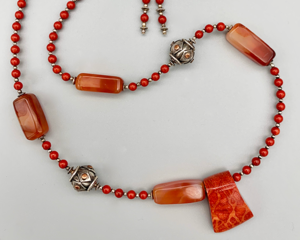 Necklace set | Sponge coral slider pendant over sterling silver and coral red rounds, Bali silver/copper, carnelian nuggets
