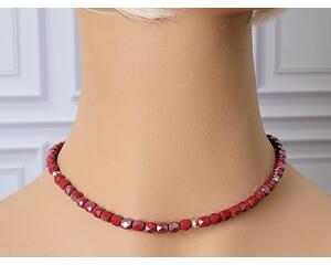 Deep red faceted glass beaded choker necklace on mannequin.