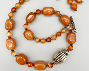 Necklace set | Carnelian planed nuggets, sparkling faceted rounds, sterling silver focal bead, Bali silver spacers and toggle clasp