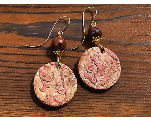 Floral textured air dry clay dangles in brown and pink hues, mookaite beads in the same colors on handcrafted 14k gold filled earring wires