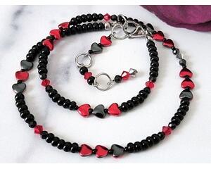 Black choker necklace with red hematite hearts.