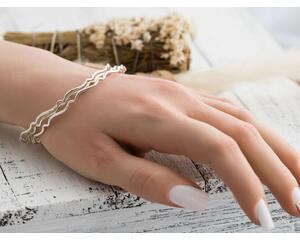 Set of three sterling silver stacking wavy bangle bracelets.