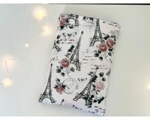 This paris book sleeve has white background with sparkly Eiffel Tower with pink flowers