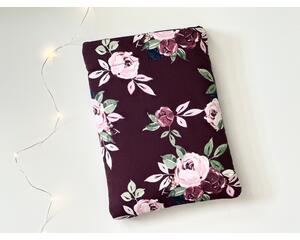 This floral book sleeve has a maroon background with red and off maroon roses