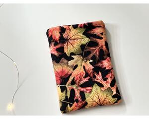 this fall kindle sleeve has a black background with fall leaves all over the autumn kindle cover