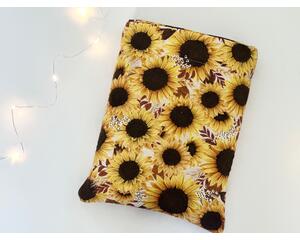 this fall sunflower book sleeve has sunflowers all over the floral book holder with brown leaves