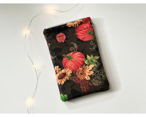 this fall kindle sleeve has a brown background with gold sparkles on the pumkins and sunflowers