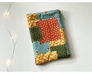 this fall kindle sleeve has fall color patchwork with different prints on each block