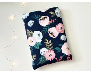 this flower book sleeve has a navy background with pink and light blue flowers and green leaves