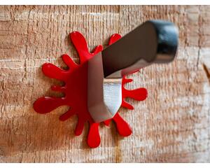 wooden wall-mount knife hook set hanging on wood wall with red blood splatter