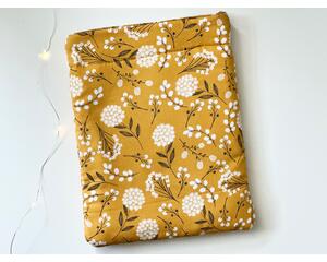 this floral tablet sleeve has a mustard yellow background with dandelions all over the tablet holder