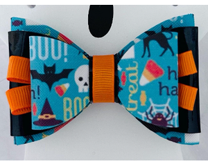 Teal & black Halloween print hair bow with loops of orange ribbon. 4 layers total. Bow is aprox. 3 1/2 x 2 1/2. Bow is sold individually. 