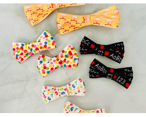 3 different 2" ribbon hair bows; colorful dots, black ABC's & apples, & colorful numbers. Also come in 3" sizes. 