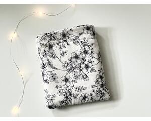 this floral kindle sleeve has a white background with black flowers and vines