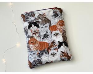 this cat book sleeve is covered in cats