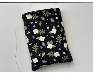 this floral book sleeve has a black background with white flowers and green and purple leaves