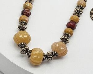 pumpkin shaped orange dyed quartz, brass accent, and sparkly diamond cut mookaite beads (brown and maroon) on brass chain with toggle clasp