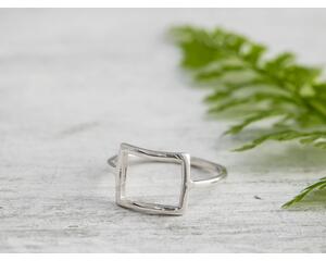 Sterling silver ring with open square design.