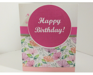 Pink, center with happy birthday letters in white, Garden flowers around the background. Light, pink trim on the bottom. The inside is white