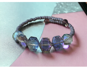 This transparent purple bracelet is handmade on memory wire.