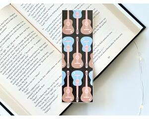 This guitar bookmark has a black background with light blue and light brown acoustic guitars covering the musical bookmark