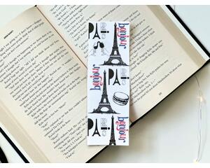 This French bookmark has a white background with the Eiffel Towers, some food all in black. And in colors blue and red is the words Paris and Bonjour