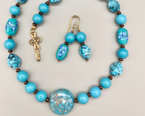 Necklace set | Antique and vintage turquoise glass beads, foil accents, charming bronze clasp