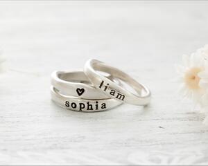 Free formed organic shaped sterling silver ring stamped with name and hearts.