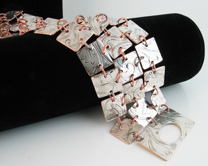 bracelet handmade of 30 1/2 inch mirror-like squares cut from a vintage silverplated tray. Fits wrist size 6.5-7.5 inches.