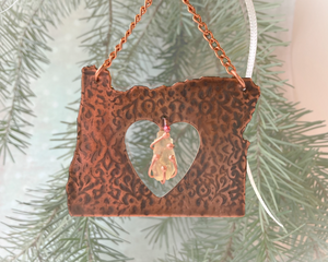 Photo of Copper I Love Oregon Ornament with Heart shape cutout in the middle and an Oregon Sunstone gemstone hanging inside the heart cutout