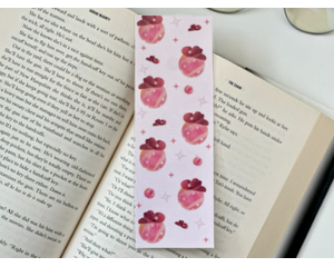 this pink western bookmark is on a white table