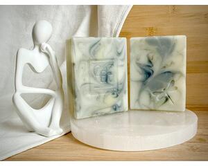 Wispy playful swirls dance in this lovely turmeric and charcoal colored natural soap.