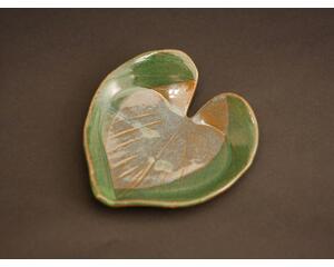 6x6" heart shaped plate with Hosta plant texture. Glazed with a dark green rim and a mixture of blue and grey throughout the middle. 