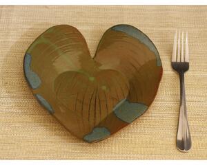Heart shaped dinner plate with Hosta plant texture. Variegated glaze in blue around edges and olive green in the middle. 8"x9"