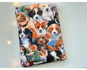 this dog book sleeve has dogs all over the book sleeve.
