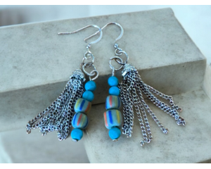 Blue bead dangle earrings with a metal tassel.  fishhook ear wires. This piece is handmade and very pretty.