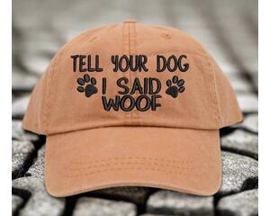 Get ready to make other dog lovers smile with this playful "Tell Your Dog I Said Woof" baseball cap.
