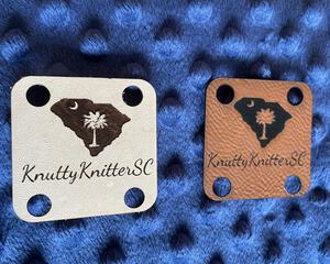 Two leather label tags view 1